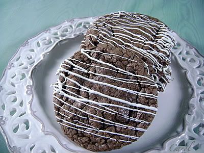 /><br/> <br/> This is a great cookie for Nutella lovers....and chocolate lovers too. Multi layers of chocolate goodness.....AND they're easy!<br/> <br/> Carol<br/> <br/> <br/> CHOCOLATE HAZELNUT COOKIES<br/> (Source: Better Homes and Gardens)<br/> <br/> 3/4 c. butter, softened<br/> 1 c. sugar<br/> 1 c. packed brown sugar<br/> 1 (13 oz.) jar Nutella chocolate hazelnut spread<br/> 1 oz. unsweetened chocolate. melted and cooled<br/> 1 tsp. vanilla extract<br/> 2 eggs<br/> 2 1/2 c. flour<br/> 1 tsp. cinnamon<br/> 1/2 tsp. baking soda<br/> 1/2 tsp. baking powder<br/> 1 c. semisweet chocolate chips<br/> 1 c. coarsely chopped, toasted, skinned hazelnuts</div> <div>Melted white chocolate for drizzling over tops of cookies (optional) <br/> <br/> Cream butter; add sugars and beat well. Add Nutella, melted chocolate and vanilla; beat to combine.</div> <div> </div> <div>Combine dry ingredients. Beat in as much as you can; stir in the rest. Stir in chips and nuts.</div> <div> </div> <div>Drop by rounded tablespoonful 2